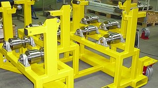 Transport rack for wheel discs suitable for 4 rail transport. The holders are offset on the frame. The transport rack provides good access from all sides and can be lifted from the rail system by crane or forklift truck.